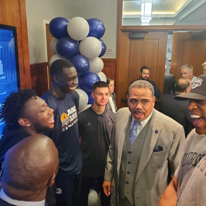 Ed Cooley, here with (L. to R.) Ivan Thomas, Jay Heath, Akok Akok, manager and Jerome Williams has to assess which  current Hoyas will be on next year's team. 