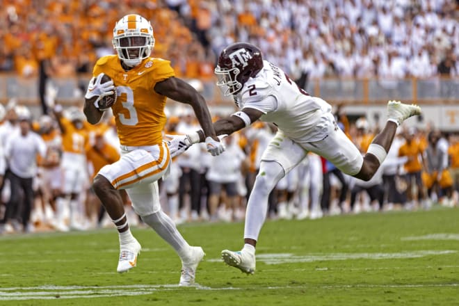 Tennessee defensive back Dee Williams (3) escapes from Texas A&M defensive back Jacoby Mathews (2) on a 39-yard punt return during the second half of an NCAA college football game Saturday, Oct. 14, 2023, in Knoxville, Tenn. (AP Photo/Wade Payne)