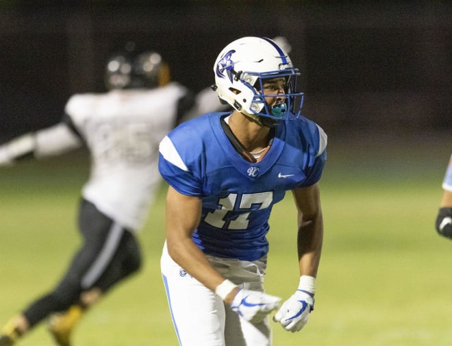 Justin Stinson of Valley Christian wearing one of Zach Alvira's top uniforms in the state