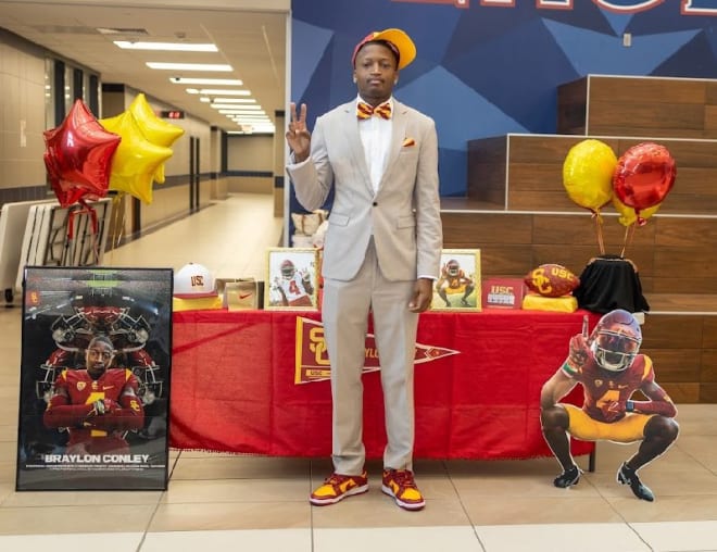 Four-star cornerback Braylon Conley poses at his signing ceremony Wednesday in Texas.