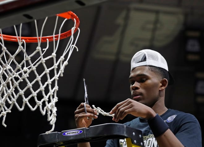 Purdue Boilermakers guard Brandon Newman (5) cuts down the net after the NCAA men s basketball game against the Illinois Fighting Illini, Sunday, March 5, 2023, at Mackey Arena in West Lafayette, Ind. The Purdue Boilermakers won 76-71.