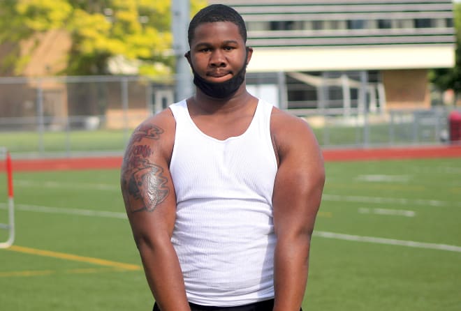 Rivals100 lineman Rayshaun Benny holds  a Michigan Wolverines football  recruiting offer from Jim Harbaugh.