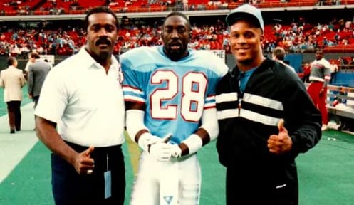 Dishman poses with former Purdue assistant Ray Sherman (left) and ex-Boiler teammate Ray Wallace during their NFL days.