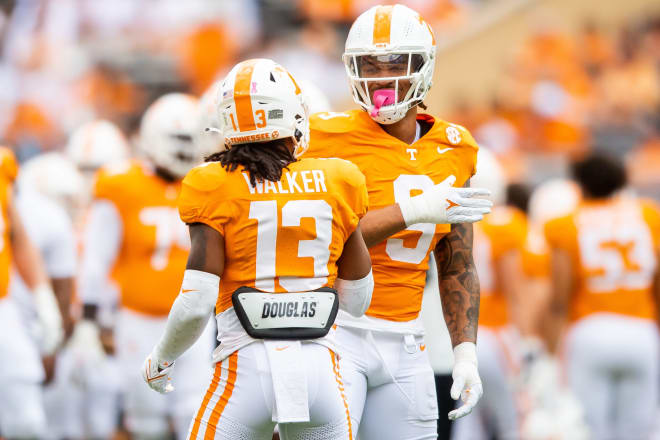 Tennessee defensive back Wesley Walker (13) and Tennessee defensive lineman Tyler Baron (9) do a handshake before a football game between Tennessee and Texas A&M at Neyland Stadium in Knoxville, Tenn., on Saturday, Oct. 14, 2023.