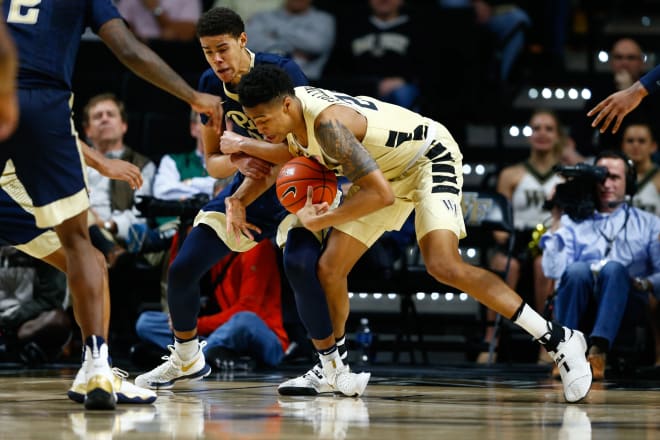 Collins snatches a loose ball during the comeback against Pitt