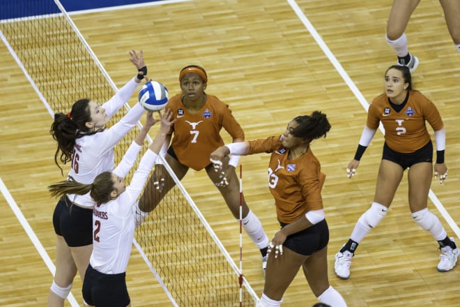 Wisconsin's Dana Rettke (16) and Sydney Hilley (2) try to block Texas's Logan Eggleston in the 2020 Final Four