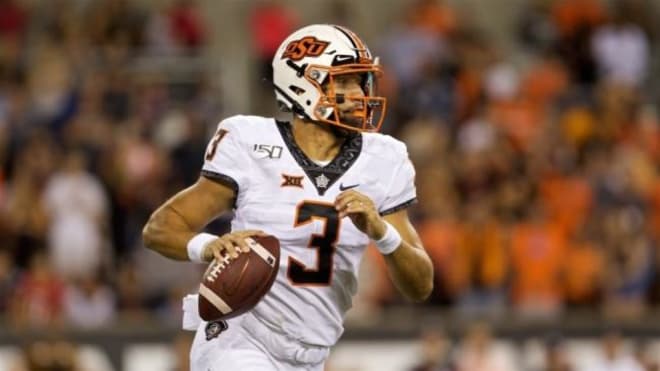 West Virginia Mountaineers football team does not know who will start at quarterback for Oklahoma State. 