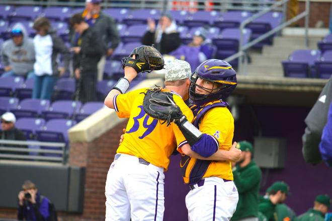 Seth Caddell congratulates Cam Colmore after the final pitch in ECU's 7-3 game three victory over William & Mary.