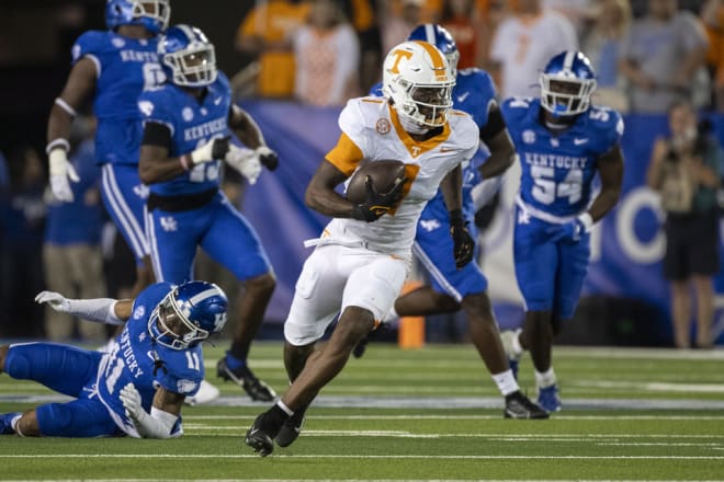 Tennessee wide receiver Dont'e Thornton Jr. (1) runs after breaking a tackle by Kentucky defensive back Zion Childress (11) during the second half of an NCAA college football game in Lexington, Ky., Saturday, Oct. 28, 2023. 