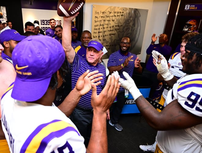 New LSU head football coach Brian Kelly received a game ball from his team Saturday night following his first win Tiger Stadium in a 65-17 blowout of Southern.
