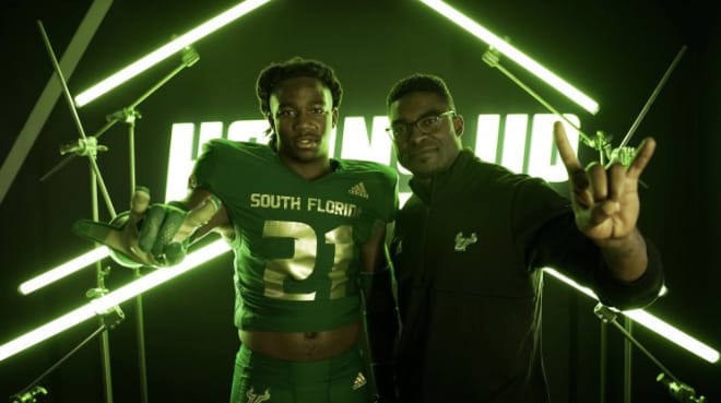 Kelly posing with Coach Sims during his JR Day visit