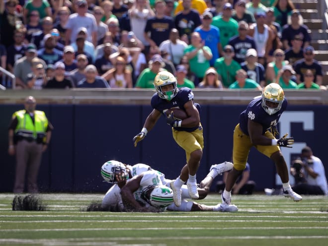 Notre Dame running back Chris Tyree, middle, has only recorded six more carries (nine in total) than kickoff returns (three).