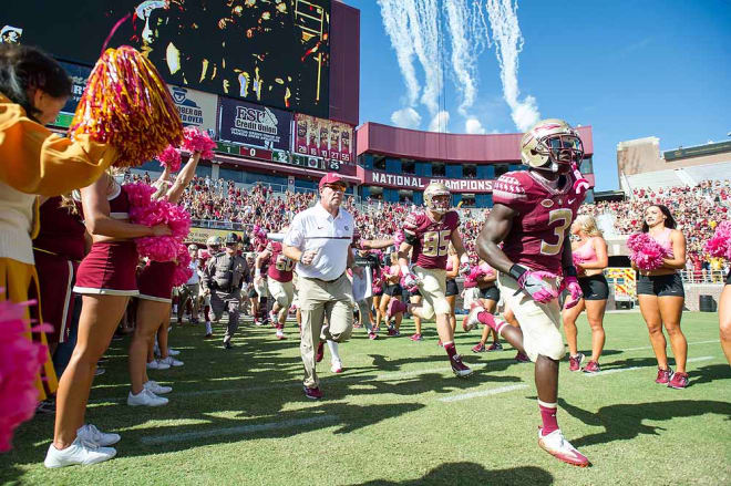 Next the FSU coaches and players storm the field