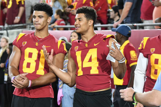 Freshman wide receivers Kyle Ford (81) and Bru McCoy (14) are being eased back this fall. Ford is a year removed from tearing his ACL while McCoy has gotten past a frustrating illness to return to working out with the team.