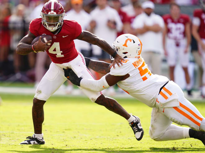 Alabama Crimson Tide quarterback Jalen Milroe (4) gets sacked behind the line of scrimmage by Tennessee Volunteers defensive lineman Omarr Norman-Lott (55) during the first half at Bryant-Denny Stadium. Photo | John David Mercer-USA TODAY