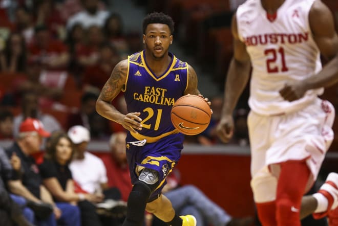 ECU guard B.J. Tyson dribbles up court during the first half against in a game against Houston last season