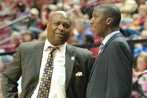 Charlton Young (right) talks during a game with head coach Leonard Hamilton.