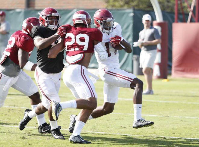 Alabama wide receiver Cam Sims, right, runs with the ball during practice. Sims has been practicing with the inside receivers so far this spring. Photo | Alabama Athletics