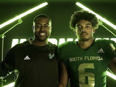 Ferguson poses with USF TE coach Xavier Dye during a JR Day visit to USF back in January 