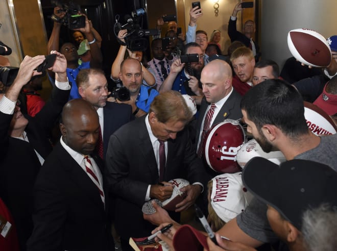Nick Saban signs autographs on Wednesday at SEC Media Days in Hoover, Alabama | Photo by Adam Hagy-USA TODAY Sports