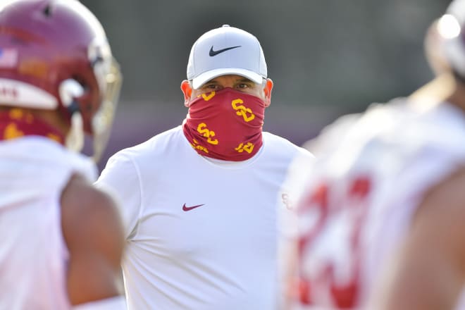 USC coach Clay Helton looks on at the Trojans' first practice Friday.