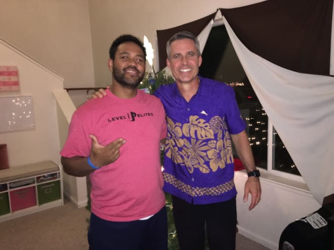 Pate Kaho (left), the father of four-star UW linebacker Ale Kaho, with Huskies head coach Chris Petersen (right) during in-home visit last December. 