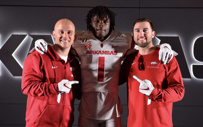 Razorback coaches Justin Stepp and Kendal Briles with Texas WR target Ketron Jackson.