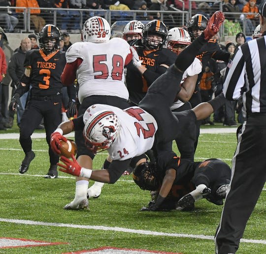 Cameron Porter scores one of his three TDs in the Lancers' state title game victory.