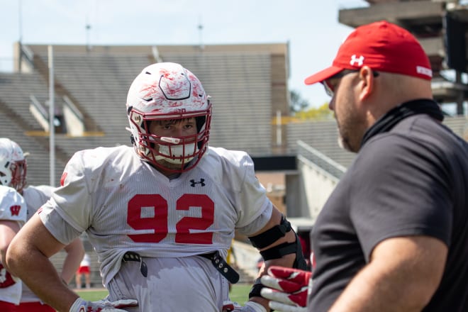 Matt Henningsen working with defensive line coach Ross Kolodziej on April 17.