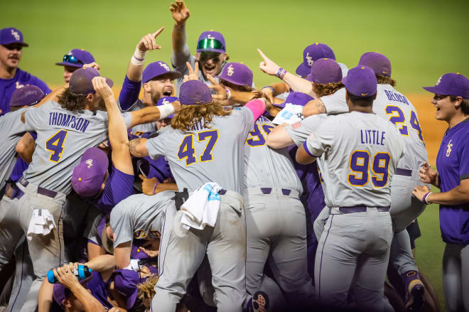 LSU players begin a dogpile on Sunday after an 8-3 NCAA Super Regional win over Kentucky in Alex Box Stadium advanced the six-time national champion Tigers to their 19th College World Series.