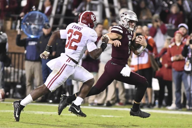  Mississippi State Bulldogs quarterback Nick Fitzgerald (7) runs the ball as he is defended by Alabama Crimson Tide linebacker Rashaan Evans (32) during the third quarter at Davis Wade Stadium. Photo | USA Today 