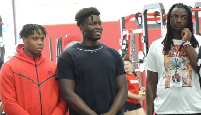 NC State hosted tackle Obadiah Obasuyi, center, this weekend for an official visit.