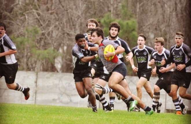 Kiernan playing rugby.