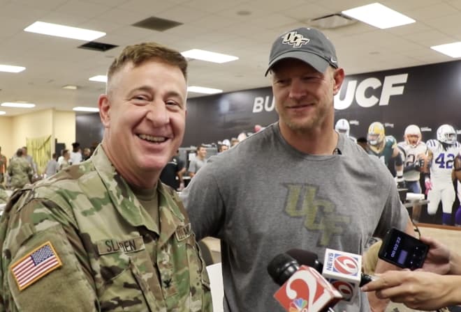 Scott Frost (right) and his UCF team have been off the past two weeks due to Hurricane Irma.