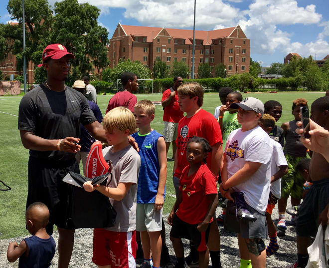 Scores of campers lined up for photos and autographs from Jameis Winston after Saturday's event at FSU.