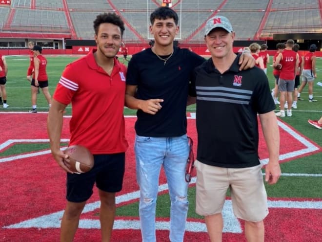 Adrian Martinez, Richard Torres and NU head coach Scott Frost