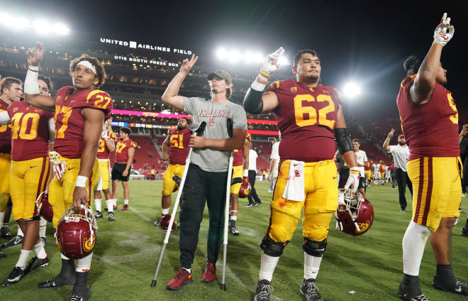 Injured sophomore quarterback JT Daniels celebrated USC's season-opening win over Fresno State with his teammates.