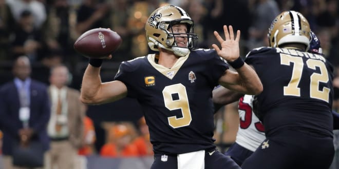 New Orleans Saints quarterback Drew Brees (9) throws against the Houston Texans during the second quarter at the Mercedes-Benz Superdome.