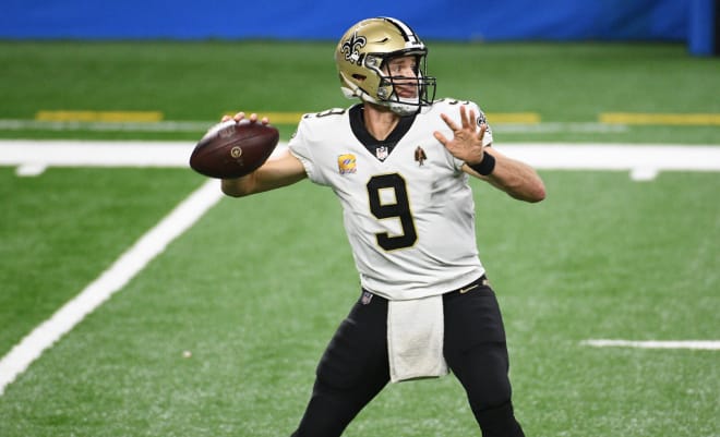 New Orleans Saints quarterback Drew Brees (9) drops back to pass against the Detroit Lions during the third quarter at Ford Field.