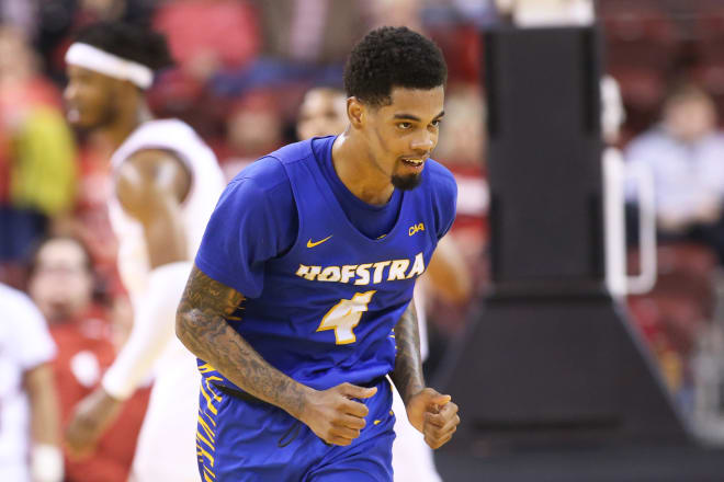 Hofstra Pride guard Aaron Estrada (4) celebrates after scoring in the second half against the Arkansas Razorbacks at Simmons Bank Arena. Hofstra won 89-81. Photo | Nelson Chenault-USA TODAY Sports