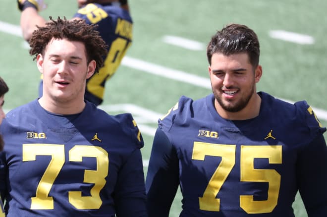 Redshirt freshman Jalen Mayfield (left) and fifth-year senior Jon Runyan are expected to start at right and left tackle, respectively, for the Michigan Wolverines football team in 2019.