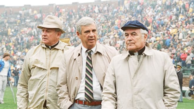 Gene Corrigan, flanked by Notre Dame leaders Rev. Ned Joyce C.S.C. (left) and Rev. Theodore Hesburgh C.S.C. (right), directed Notre Dame athletics from 1981-87.