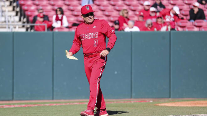 NC State baseball coach Elliott Avent handles the lineup card.