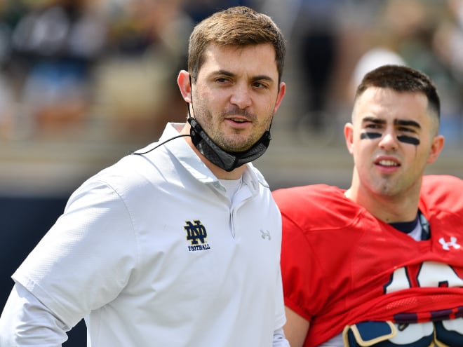 Notre Dame offense coordinator Tommy Rees, left and pictured with Irish quarterback Drew Pyne, has reportedly offered a second quarterback recruit in the 2025 class.