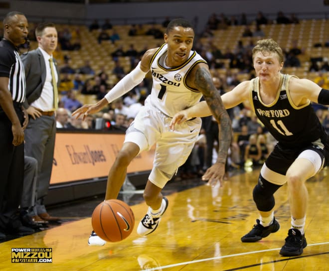 Xavier Pinson keyed a 13-0 run that opened things up for the Tigers in the second half