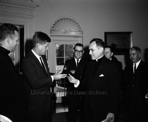 Father Ted Hesburgh presents President John F. Kennedy the Laetare Medal on Nov. 22, 1961.