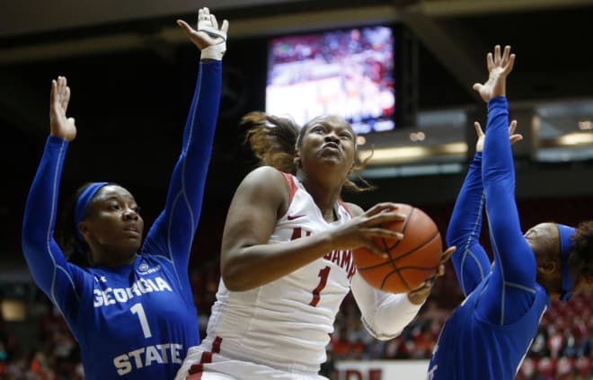 Alabama forward Quanetria Bolton (1) splits Georgia State forward Tiffany Holston (1) and Georgia State guard Jaylyn Harrison (4) as she tries to get to the basket. The University of Alabama women hosted Georgia State during a day game tailored to Tuscaloosa area fifth graders Thursday, December 15, 2016 in Coleman Coliseum. Staff Photo/Gary Cosby Jr.