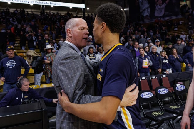 Head coach Tad Boyle hugs former Buff Daylen Kountz after the game on Dec. 18