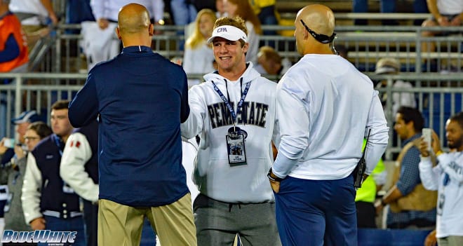 Patterson meets with James Franklin (left) and Mike Villagrana (right) about an hour before the game against Michigan.