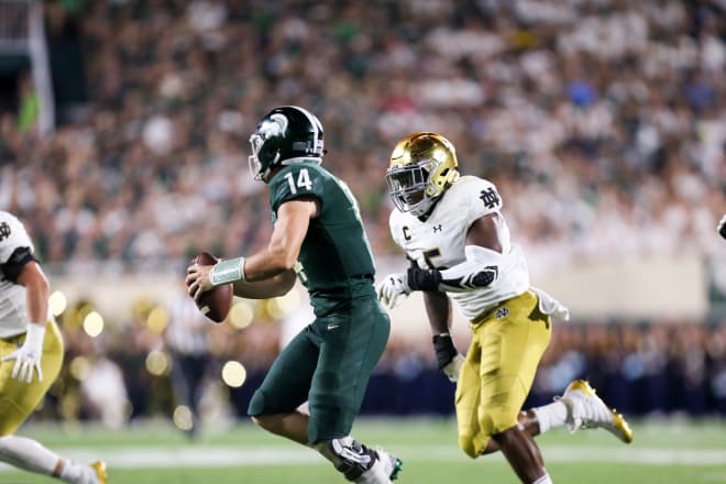Linebacker Nyles Morgan attempting to make a tackle against Michigan State.